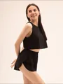 Detail van zwarte crop top en korte broek van ademende jacquardstof met een hoge tailleband - S / Zwart