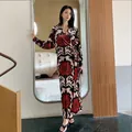 Women's long-sleeve velvet robe with striking red and black abstract leaf pattern - M / Red Black Leaf Print