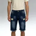 Detail of dark blue men's denim shorts featuring ripped holes and cuffed leg openings - Dark Blue