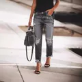 Jean gris foncé pour femme avec déchirures, moustaches et ourlet à bords francs - S / Gris
