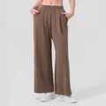 Dames sportbroek met wijde pijpen in diepbruin met hoge taille en elastische band - S / Nootbruin