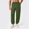 Loose fit olive green men's joggers with elastic drawstring waist and cuffed ankles - S / Moss Green