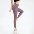 High-waisted yoga leggings in smoky purple featuring practical side pockets for gym wear - XL / Wood Purple