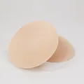 Pair of breathable beige round sponge bra inserts with honeycomb mesh for sports bras - S / Nude