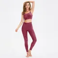 Women's burgundy marble print yoga set featuring high-waist leggings and sports bra - XL / Red