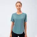 Camiseta de yoga holgada para mujer en color verde azulado con dobladillo curvo - 2/XS / Azul