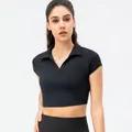 Women's black slim fit cropped polo shirt for yoga and fitness training session - 2/XS / Tops / Black