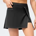 Women's black high-waisted sports skort with hidden side pocket and white reflective trim - 2/XS / Bottoms / Black