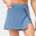 Mist blue athletic skort with asymmetric wrap front, white piping, and side pocket detail - 2/XS / Bottoms / Stone Blue