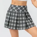High-waisted black and white plaid pleated tennis skirt with a minimalist athletic design - 10/XL / Bottoms / Black Plaid