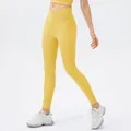 Slim fit yellow ribbed yoga pants with high waisted crossover design and side pockets - S / Bottoms / Malt Yellow