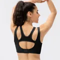 Black racerback sports bra featuring a hollowed-out back design and adjustable buckle - S / Black