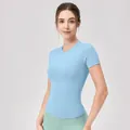 Nauwsluitend lichtblauw yoga t-shirt met korte mouwen en ronde hals voor dames sportkleding - S / Hemelsblauw