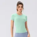 Nauwsluitend muntgroen yoga t-shirt met ingebouwde pads voor dames fitness sporten - S / Mistgroen