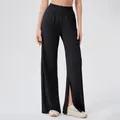 Women's black high-waisted wide-leg yoga pants with side slits and elastic waistband - Black