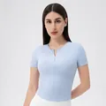Slim fit light blue short sleeve yoga top with front zipper and built-in pads - Light Blue