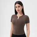 Short sleeve yoga top in dark brown with front zipper and slim fit athletic silhouette - Pine Nut Brown