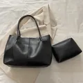 Minimalist black tote bag set with matching zipper pouch in crinkled faux leather - Black