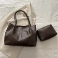 Minimalist deep brown leather tote bag set with small matching pouch for daily commute - Brown