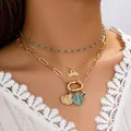 Set collana dorata a tre strati con perline blu, ciondoli a conchiglia e scritta cocktail - Set a Tre Strati (A11529)