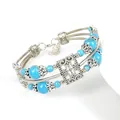 Bracciale boho in lega d'argento con perline turchesi blu e motivi floreali traforati - Blu