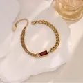 Retro-Armband aus 18K vergoldetem Stahl mit rotem Zirkonia und asymmetrischer Kette - Einzelnes Armband (TZ004-1)
