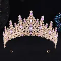 Detailed view of vintage gold crown with intricate scrollwork and purple crystal rhinestones - Gold White Light Purple