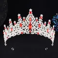 Close-up of European style silver bridal crown with red water-drop gems and sparkling rhinestones - Silver White Red