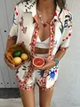 Detail shot of summer two-piece set featuring colorful artistic prints and orange piping - XS / Top And Bottom / Off-White Sun Heart Style (HA-DXCSTZ-017)