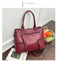 Elegant burgundy red PU leather handbag with litchi grain and decorative tassels - Burgundy