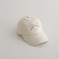 Kids cream baseball cap with pink embroidered bow and curved brim in cotton canvas - 2-8 Years / Off White