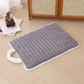 Gray rectangular plush dog sleeping mat with quilted stripes and white fuzzy handle - Grey Grid Handheld Mat