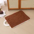 Brown plush pet mat with striped texture and white handle on light wooden floor - Coffee Grid Handheld Mat