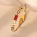 Detailed view of 18k gold plated bangle with red enamel inlay and cubic zirconia stones - Red Shell