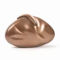 Macro shot of bronze textured acrylic evening bag with organic pebble-shaped hard shell - Coffee