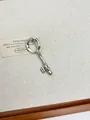 Minimalist silver key-shaped brooch with a sleek streamlined design and polished finish - Streamline Twisted Key Shape (XZ0127B) / Silver