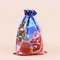 Detail of blue Christmas drawstring gift bag with Santa Claus, reindeer, and ribbon closure - Sleigh Santa / 29x43cm