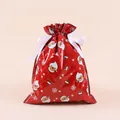 Detail of red Christmas drawstring gift bag with Santa and snowflake patterns - Red Santa / 24x32cm