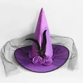 Detail of purple satin witch hat featuring black feathers, silk roses, and sheer mesh veil - One Size / Purple