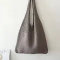 Medium gray hollowed-out knit tote bag featuring a crochet mesh design for holiday travel - Hollow Mesh / 802 Heather Grey