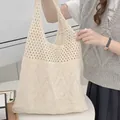 Beige knit shoulder bag with crochet mesh and diamond pattern worn by a model - Diamond Hollow / 801 Apricot