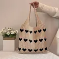 Beige knitted tote bag with black heart patterns and long handles for holiday travel - Heart Jacquard / Heart Khaki