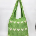 Green knit shoulder bag featuring white heart patterns and vertical ribbed texture - Heart Jacquard / Heart Green