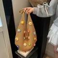 Ginger yellow knit shoulder bag featuring colorful handmade crochet flowers and mesh texture - Multi-color 3D Flowers / 609 Fifteen Flowers