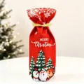 Detailed view of red Christmas wine bottle bag with festive snowflake and reindeer motifs - Green Christmas Tree Wine Bottle Cover