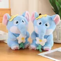 Blue plush elephant doll with pink ears holding a white flower accessory on wood table - Elephant With Flowers 32 Cm / Price And Color Are Random For Single Pieces Around 40cm In Length.