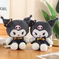 Adorable Kuromi plush doll in dark blue dress with golden bow and pink skull detail - Dress Kuromi 32 Cm / Price And Color Are Random For Single Pieces Around 40cm In Length.