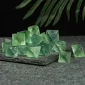 Natural green fluorite octahedron crystals displayed on a grey stone base decoration - Green Fluorite Octahedron (Large - Pack)