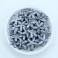 Macro detail of glossy starfish ceramic beads in a white bowl for DIY jewelry - Dark Gray