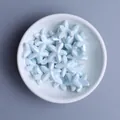 Close-up of light blue glazed starfish ceramic beads for DIY jewelry making and crafts - Light Lake Blue